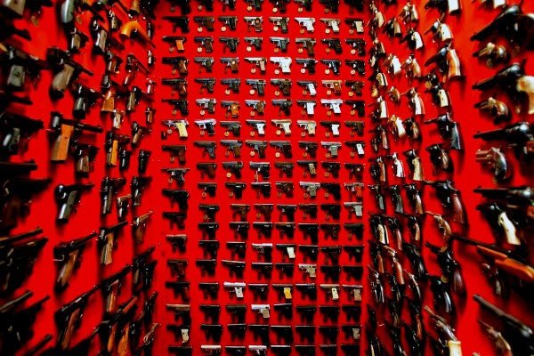 incredible-room-with-wall-mounted-pistols-and-red-paint
