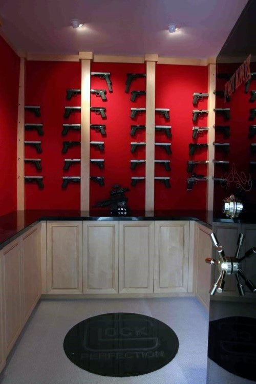 walk-in-gun-room-safe-with-red-walls-glock-themed