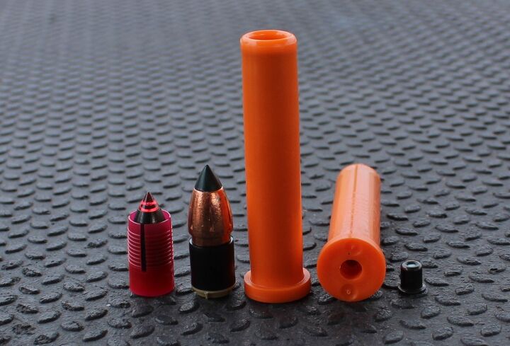 Two Muzzleloader Sabot Bullets, One Within A Plastic Casing Used